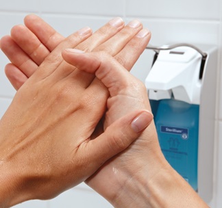 Close-up of two hands, rubbing the disinfectant in.