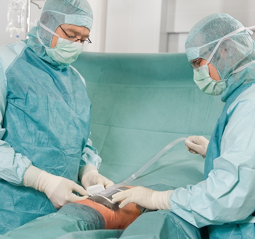 Two doctors performing operation