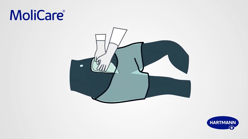 Illustration of a caregiver applying the MoliCare® Premium Form STOOL large pads on a bedbound person.